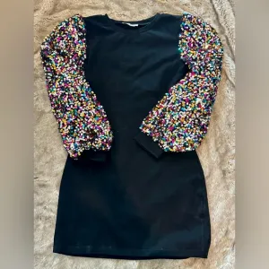 Black Dress with Sequin Sleeves