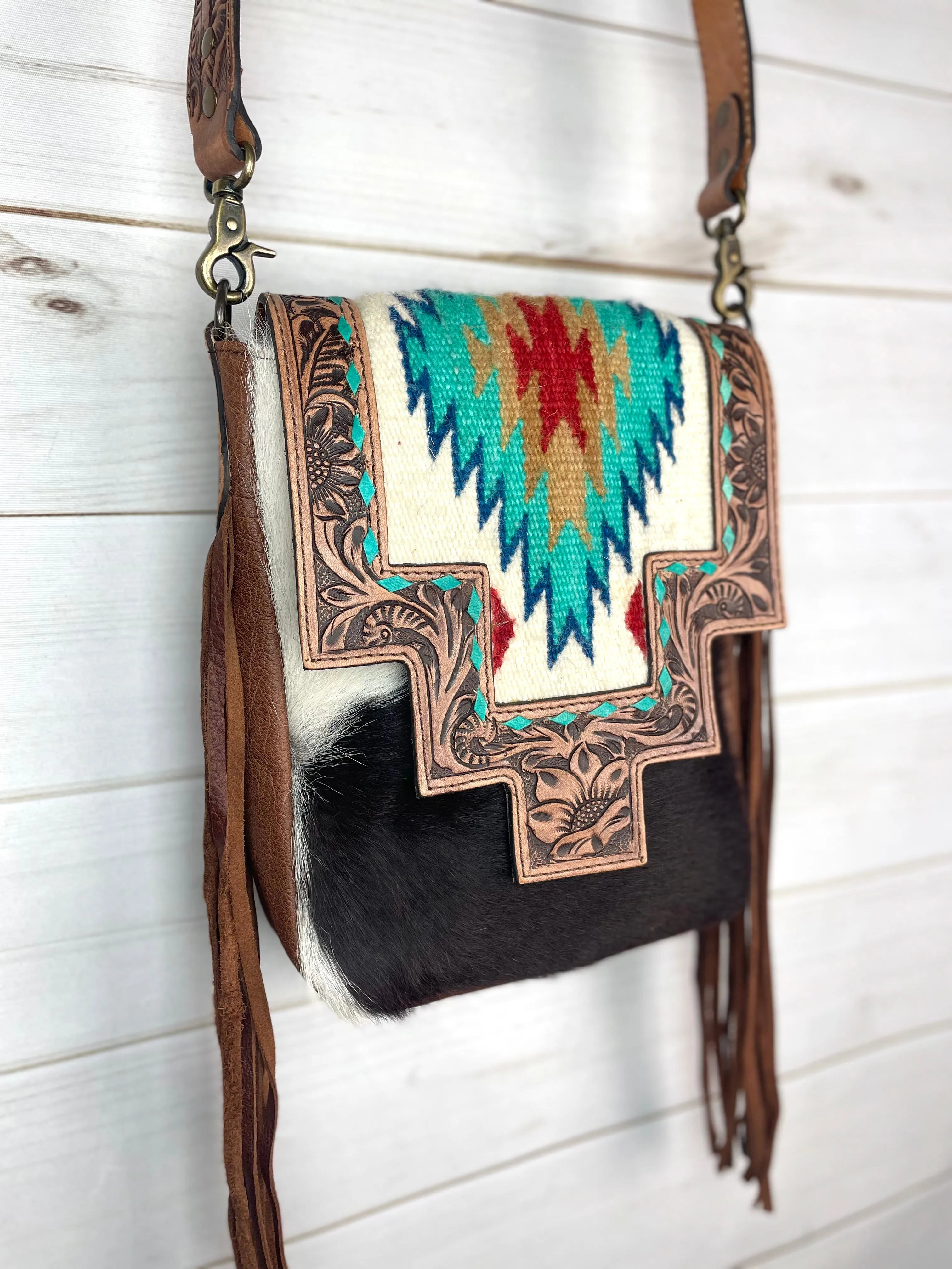 Monument Turquoise Wool Pattern Inset Tooled Leather Over Hide