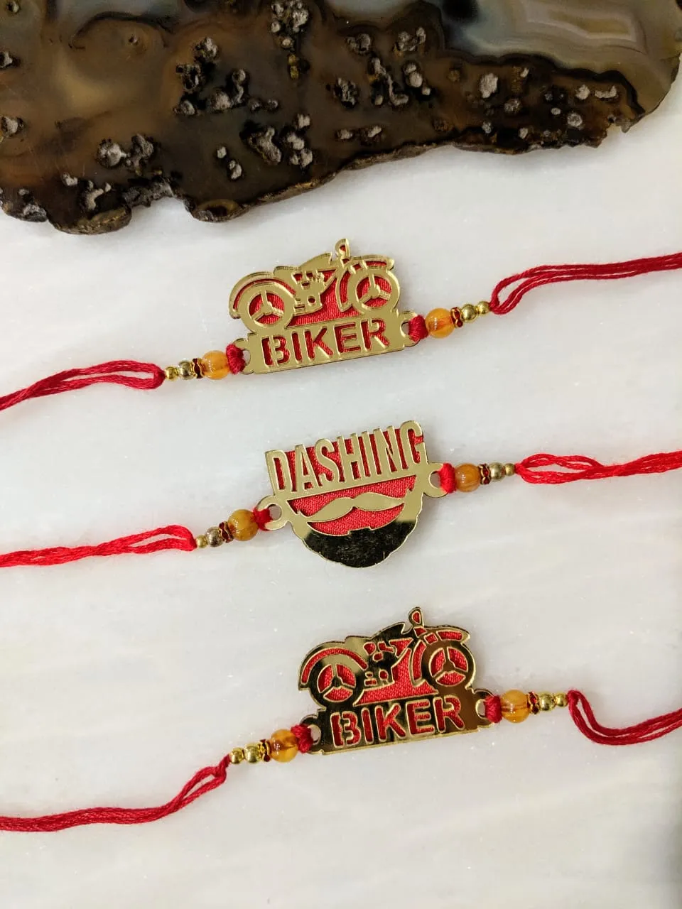 (Set of 3) Golden Rakhi with Dashing/ Biker Slogan Beads Red Thread Rakhi For Men