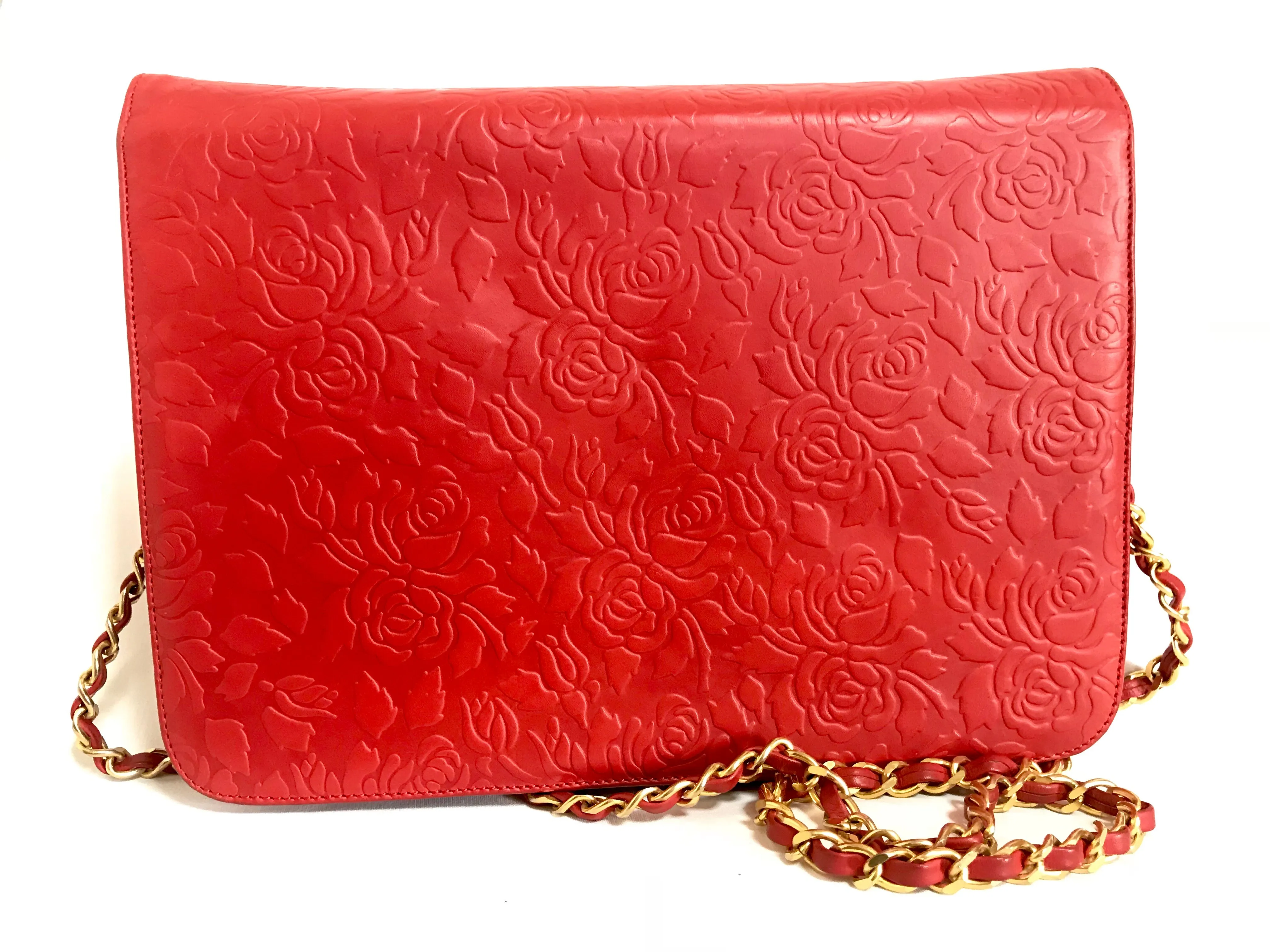 Vintage Valentino Garavani red leather chain shoulder bag with rose flower embossed design and round V motif. Can be clutch bag.