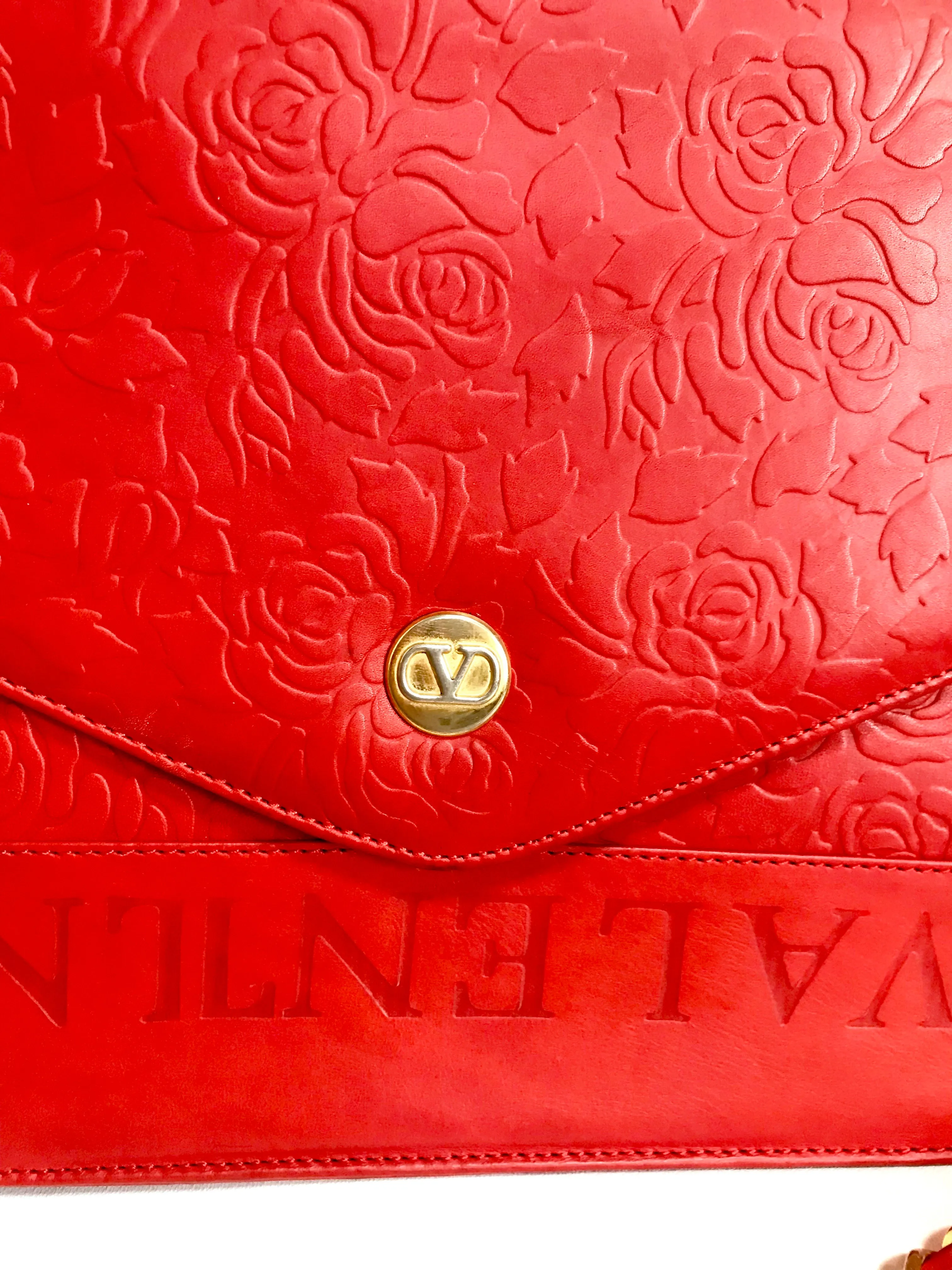 Vintage Valentino Garavani red leather chain shoulder bag with rose flower embossed design and round V motif. Can be clutch bag.